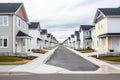 symmetrical rows of similar newly built houses