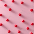 A symmetrical seamless 3D pattern with a single black cherry contrasted with glossy red cherries. Royalty Free Stock Photo