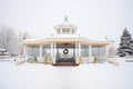 symmetrical shot of gazebo entrance with snow drifts