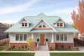 symmetrical twostory home with hip roof and dormer windows