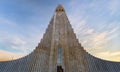Symmetrical view of the minimalist architecture of HallgrÃÂ­mskirkja Cathedral based on the basalt formations of Iceland