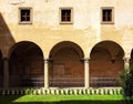 Symmetrical View of Traditional Italian Facade & Arcade under Noon Sunlight in Florence, Italy