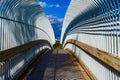 Symmetrical white pedestrian bridge Royalty Free Stock Photo