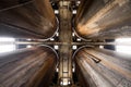 Geometric view of four rusty silos as seen from below