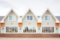 symmetrical windows flanking a farmhouse gable