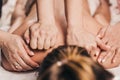 Symmetrical work of two massage therapists at the same time - four-hand massage