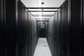 Symmetrically telecommunication racks in corridor.