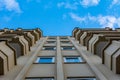 Symmetry of balconies and windows against the blue sky Royalty Free Stock Photo