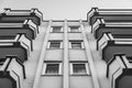 Symmetry of balconies and windows against the blue sky Royalty Free Stock Photo