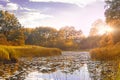 Symmetry reflection on the autumn river. Sunrise. Royalty Free Stock Photo