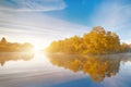 Symmetry reflection on the autumn river. Sunrise. Royalty Free Stock Photo