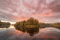 Symmetry reflection on the autumn river. Sunrise. Royalty Free Stock Photo