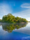 Symmetry reflection on the summer river Royalty Free Stock Photo