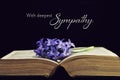 Sympathy card with flower and open book Royalty Free Stock Photo