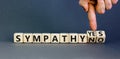 Sympathy yes or no symbol. Concept words Sympathy yes or Sympathy no on wooden cubes. Psychologist hand. Beautiful grey table grey Royalty Free Stock Photo