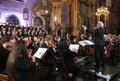 Symphonic orchestra performing live in the baroque basilica.