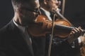 Symphonic string orchestra performing on stage