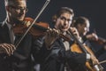 Symphonic string orchestra performing on stage