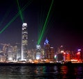 International Finance Centre with green laser lights during Symphony of Lights, Hong Kong Royalty Free Stock Photo