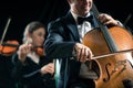 Symphony orchestra performance: celloist close-up Royalty Free Stock Photo