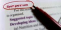 symposium biological word written on english language with red colour covering text form Royalty Free Stock Photo