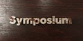 Symposium - grungy wooden headline on Maple - 3D rendered royalty free stock image