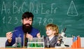 Symptoms of ADHD at school. Teacher child test tubes. School lesson. Chemical experiment. Difficult focus and complete Royalty Free Stock Photo