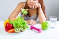 Symptoms of anorexia manifested in aversion to food. Portrait of young Asian woman in unsatisfied facial emotional expression, Royalty Free Stock Photo