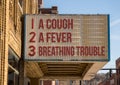 Symptoms of Coronavirus infection on downtown Main Street cinema