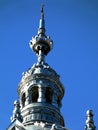 Synagogue building`s metallic grey zink tower under blue sky