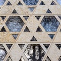 Synagogue Ulm with windows in shape of Jewish badge with bare trees reflections, Baden-Wuerttemberg, South Germany Royalty Free Stock Photo