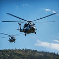 Synchronized flight two choppers command the vibrant blue airways Royalty Free Stock Photo