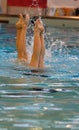 Synchronized swimming team practice detail vertical