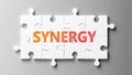 Synergy complex like a puzzle - pictured as word Synergy on a puzzle pieces to show that Synergy can be difficult and needs