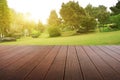 Synthesis of textured wooden planks floor and green field background.