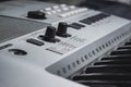 Synthesizer close-up. Keys and settings buttons. Blurred background Royalty Free Stock Photo