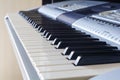 A synthesizer or electronic piano keys. Musical education for kid in music school