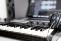 Synthesizer keyboard and headphone lying on Music studio Royalty Free Stock Photo