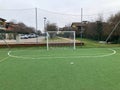 synthetic five-a-side football pitch with goals and penalty area