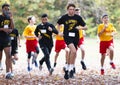 Runners at start of cross country race with face masks and blurred background