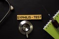 Syphilis - Test on top view black table with blood sample and Healthcare/medical concept