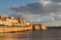 Sunset at the seaside promenade and the Maniace Castle on the Is