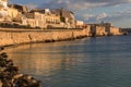 Sunset at the seaside promenade and the Maniace Castle on the Is