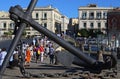 Enormous old ship\'s anchor near the building of Shipping Office in the historic city of Syracuse