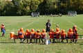 Syracuse, New York, U.S - October 15, 2022 - The little kids football players on the field with their coach