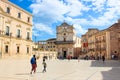 Syracuse, Sicily, Italy - Apr 10th 2019: Historical Piazza Duomo Square in Ortygia Island photographed with tourists on a sunny