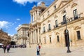 Syracuse, Sicily, Italy - Apr 10th 2019: Tourist on Piazza Duomo Square in Ortygia Island. The dominant of the historical center