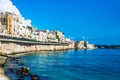 Syracuse, Sicily, Italy Ã¢â¬â August 23, 2018 : Panoramic view of the Ortigia waterfront in Syracuse with the blue sky background Royalty Free Stock Photo