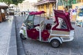 A traditional three wheel taxi on the streets of Siracusa, Italy