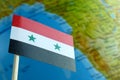 Syria flag with a globe map as a background